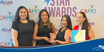 POGA Staff Members Pose with Award