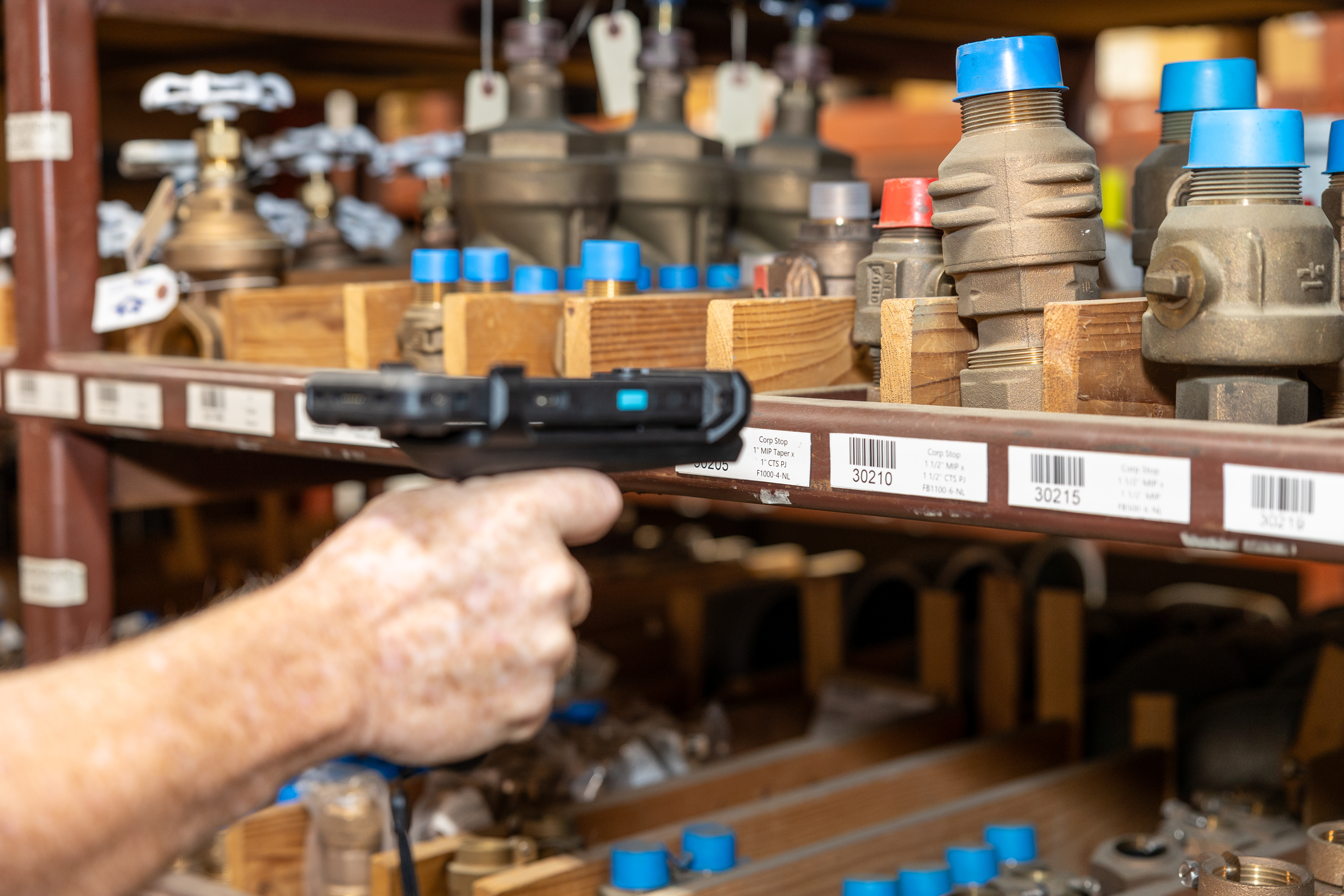 Member of Purchasing team taking inventory